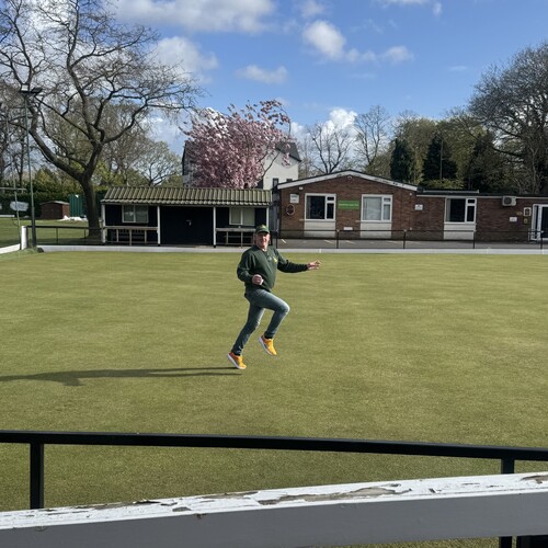 Neil cantering across the green